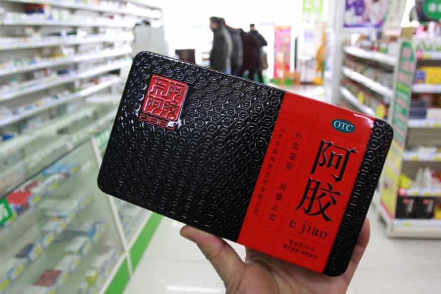 A customer shops for ejiao, or donkey-hide gelatin, at a pharmacy in Nantong, China.