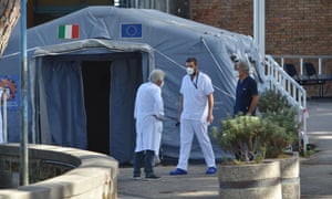 Medical staff at the entrance of a hospital in Naples on October 6.