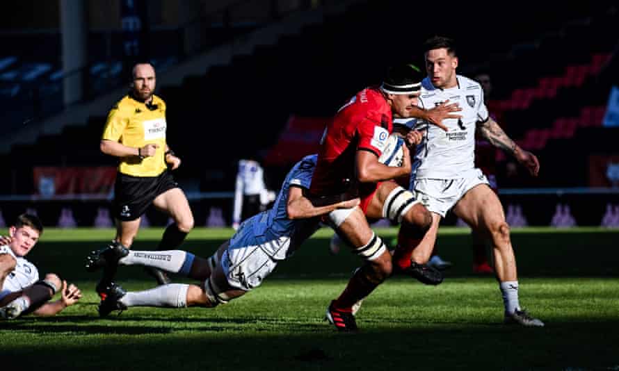 Lyon’s Dylan Cretin is tackled as tries to break through the Gloucester defence.
