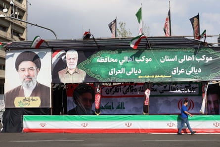 Tehran amid escalating conflict with US and Israelepa12861681 An Iranian man walks next to a poster of Iranian supreme leader Mojtaba Khamenei (L) displayed in a street of Tehran, Iran, 31 March 2026. A joint US and Israeli military operation, launched on 28 February, continues to target strategic sites across Iran. EPA/ABEDIN TAHERKENAREH