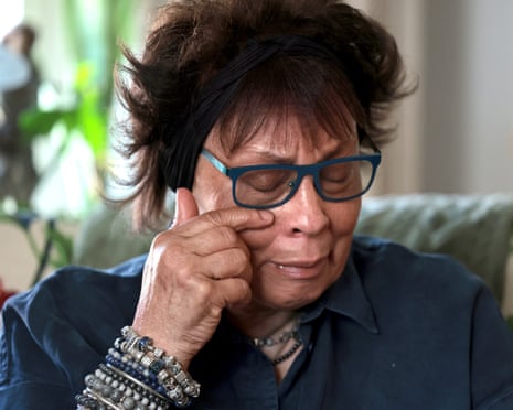 Joyce Thomas wipes tears from her face