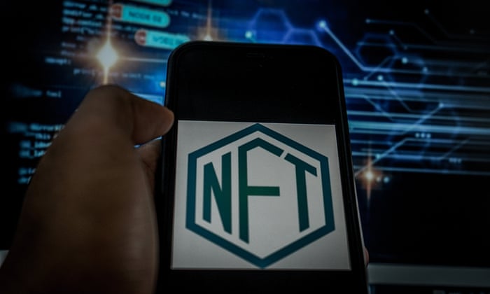 A cell phone with the NFT logo on the screen.