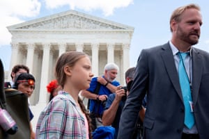 Greta Thunberg leaves after a gathering outside the US supreme court.