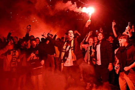 Australia fans celebrate in Melbourne after victory over Denmark.