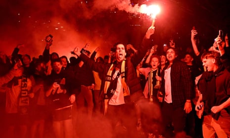Australian fans celebrate in Melbourne after Australia’s victory over Denmark (Photo by William West/AFP via Getty Images)