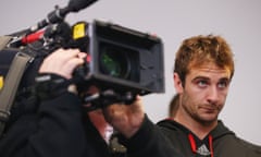 Bombers captain Jobe Watson looks on as James Hird speaks to the media following his resignation as head coach.