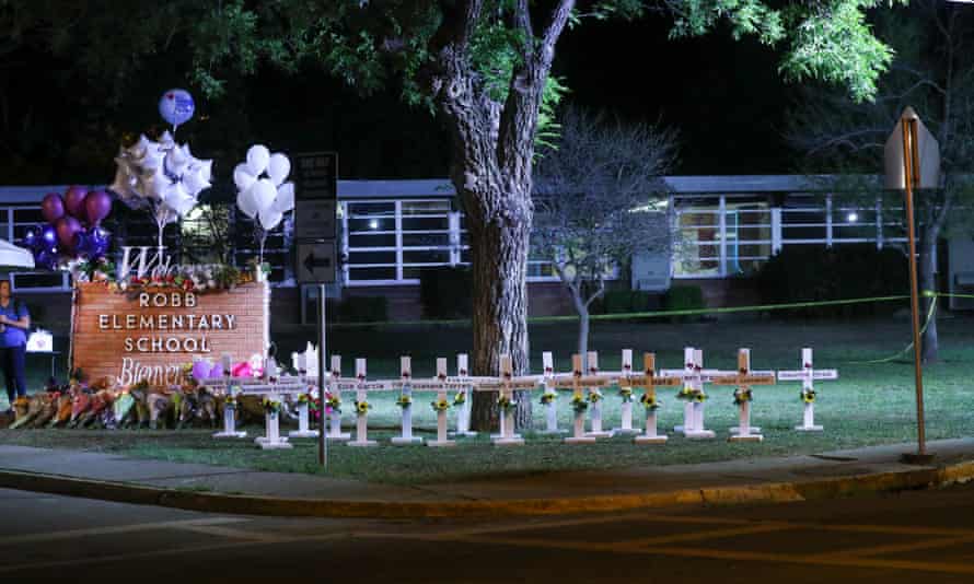 The memorial has been augmented with small crosses for each of the child victims of the shooting.