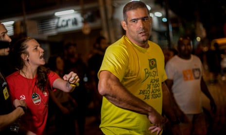 A Bolsonaro supporter is yelled at by a won supporting Fernando Haddad at a Haddad event in Rio de Janeiro on election night.