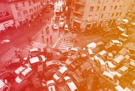 Cars swept into a pile by torrential rain in Genoa, Italy Saturday.