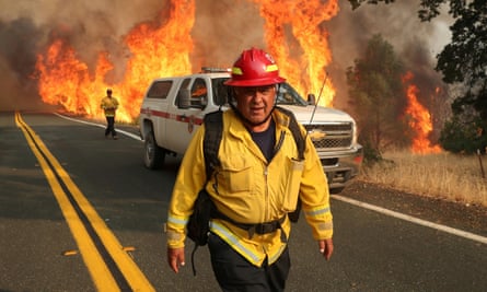 Chula Vista firefighter Rudy Diaz monitors the LNU Lightning Complex Fire as it engulfs brush in Lake County, California, August 23, 2020.
