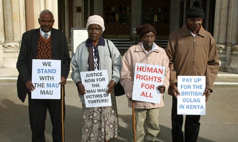 Kenyan campaigners hold placards outside the Royal Courts of Justice