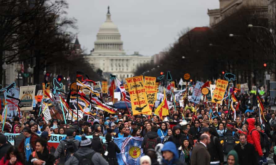 Protesters march during a demonstration against the Dakota Access pipeline on 10 March. Trump revived the project after taking office.