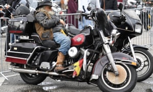 A biker rests on his Harley-Davidson bike at the âHamburg Harley Daysâ in Hamburg yesterday