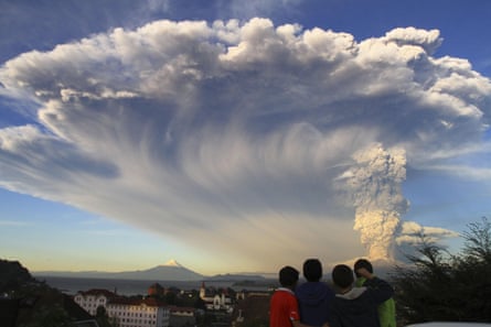 Children watch the Calbuco volcano erupt, from Puerto Varas, Chile.