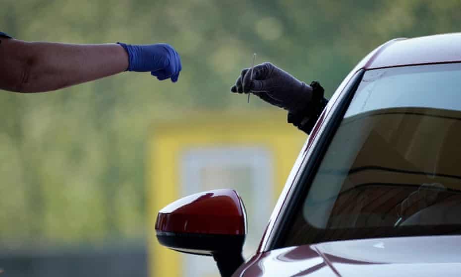 A driver returns a swab at a test centre in Sheffield