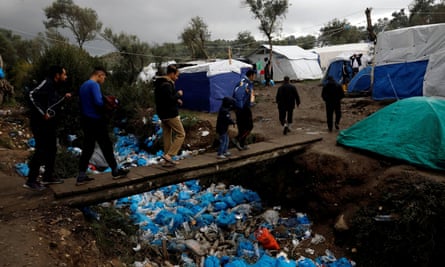 Conditions in the makeshift camp in the olive groves are dire, with insufficient shelter for new arrivals and rivers of rubbish.