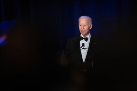 a man in a suit speaks