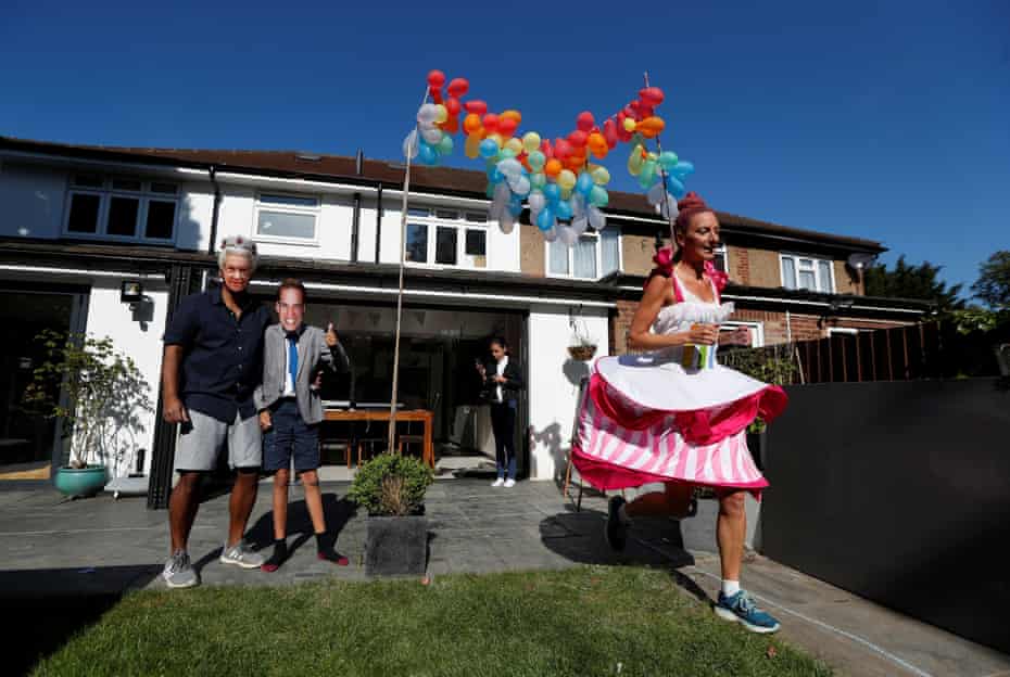 Anna Bassil runs a marathon distance on 26 April 2020 dressed as a cake around her garden in St Albans, after the London Marathon had to be postponed.
