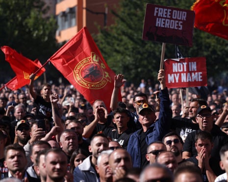 Supporters of former Kosovo President Hashim Thaci gather on the day he and other former Kosovo Liberation Army (KLA) members hear the judgment in their war crimes trial at the Kosovo Specialist Chambers in The Hague, in Pristina, Kosovo.