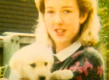 Colour photograph of Diane Sindall holding a puppy