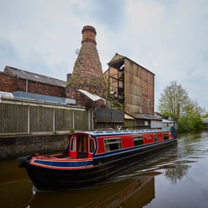 A bottle oven at Dolby Flint Mill, Stoke-on-Trent, stands in the background with a canal in the foreground