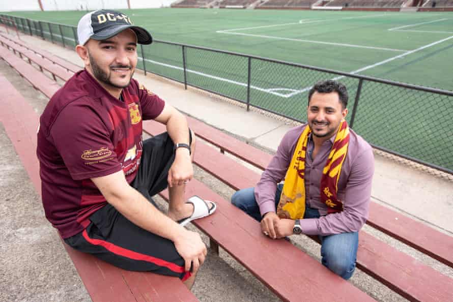 Salah Hadwan, front, and Moortadha Obaid, pose for a photo at the stadium of Detroit FC.
