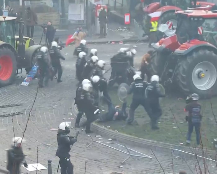 Police seen kicking demonstrator at farmers' protest in Brussels – video