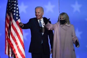 Democratic presidential nominee Joe Biden and his wife Jill Biden wave to supporters after speaking during election night at the Chase Center in Wilmington, Delaware