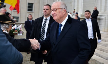 Retired King Albert II of Belgium shaking hands outside church