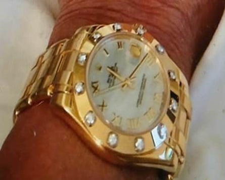 A gold, diamond-encrusted Rolex watch