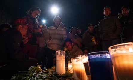 Migrants light candles during a vigil outside the immigration facility in Ciudad Juarez.