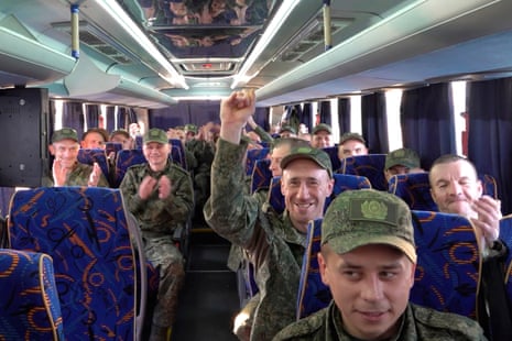 Russian servicemen board a bus upon arrival to Chkalovsky airport, outside Moscow after returning from captivity as part of the PoW exchange between Russia and Ukraine.