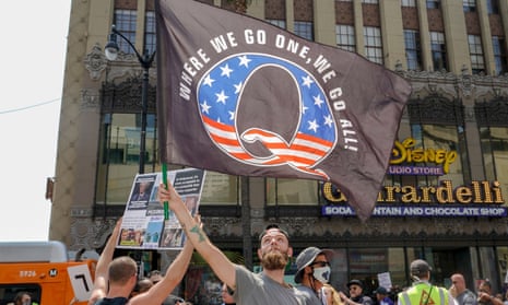 Members of the conspiracy theorist group QAnon demonstrate in Los Angeles. 