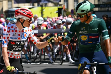 Visma-Lease a Bike’s Jonas Vingegaard (L) fist bumps Lidl-Trek’s Jonathan Milan before stage six in Bayeux, north-western France.