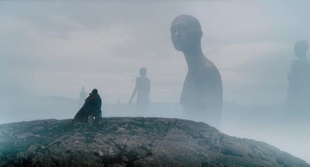 Movie still showing Sir Gawain meeting the giants on a misty mountain