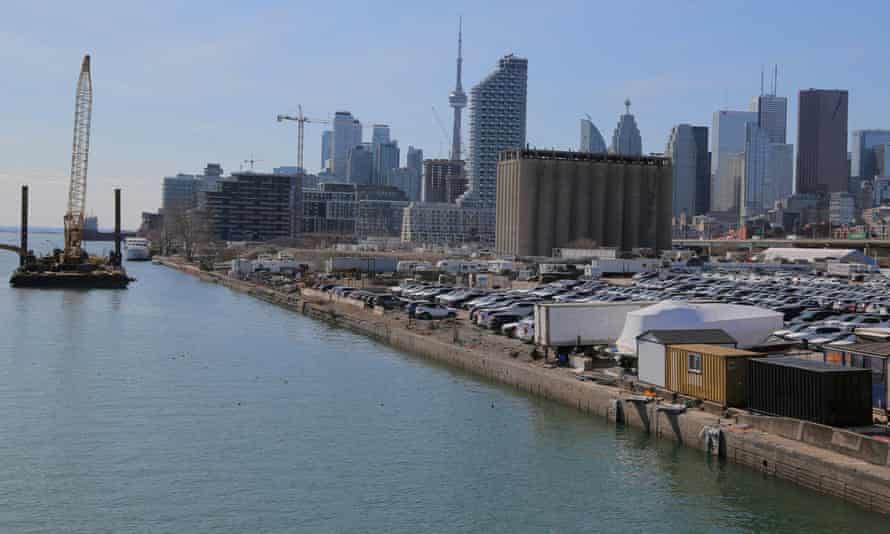 The downtown skyline and CN Tower are seen past the eastern waterfront area in the Port Lands district of Toronto.