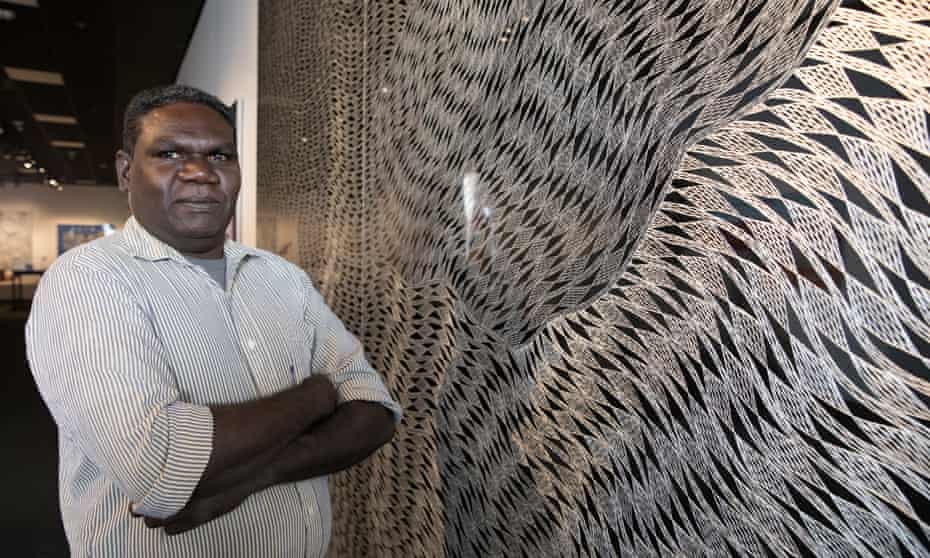 Gunybi Ganambarr, the overall winner of the 2018 Telstra National Aboriginal and Torres Strait Islander Art awards, with his winning work, Buyku.