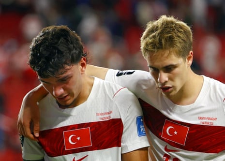 Turkey's Can Uzun and Kenan Yildiz look dejected after the match.