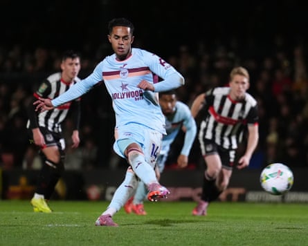 Fábio Carvalho gets up after being brought down for a penalty to score Brentford’s fourth