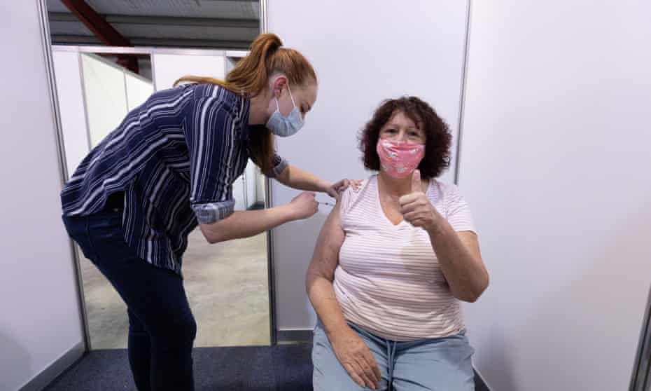 Jo Dytlewsk receives a Covid vaccine from nurse Siobhan Cheeseman at the Claremont showground mass vaccination centre in Perth, Western Australia