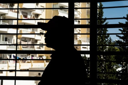 Martial from Central African Republic pictured in silhouette at a refugee centre in Tunis