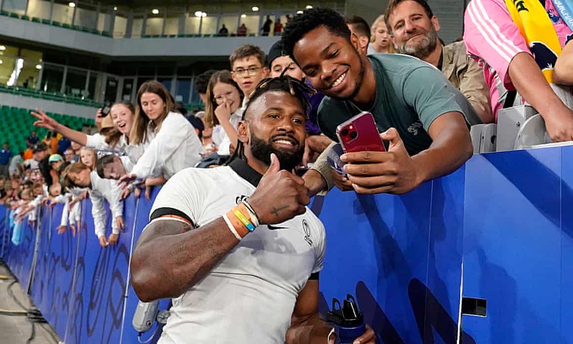 Fiiji captain Waisea Nayacalevu poses with fans.
