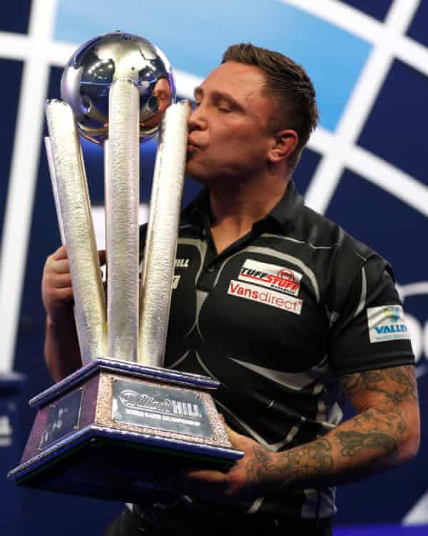 Gerwyn Price kisses the PDC world championship trophy
