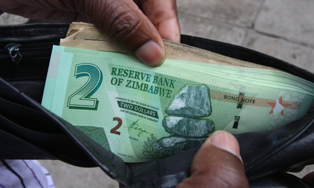 A Zimbabwean man shows off new bond notes in Harare. 