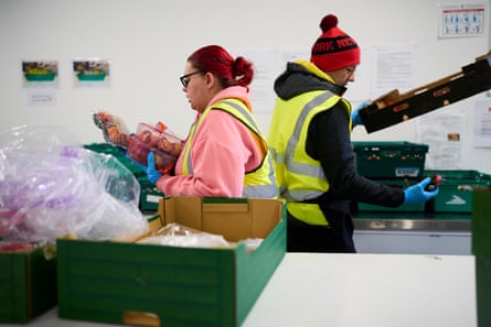 Volunteers filling food crates