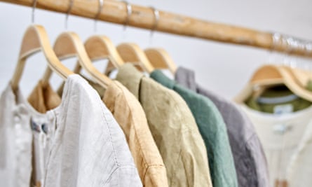 Fair trade linen organic clothes of neutral tones on hanger