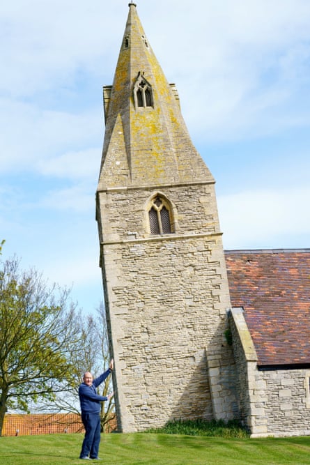 Man pretending to hold up the leaning church tower