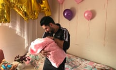 Asmar Halabi with his 11 day old little girl, Layana, at home in Izmir, Turkey.