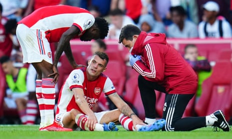 Granit Xhaka receives attention after suffering a knee injury during Arsenal’s win over Tottenham.