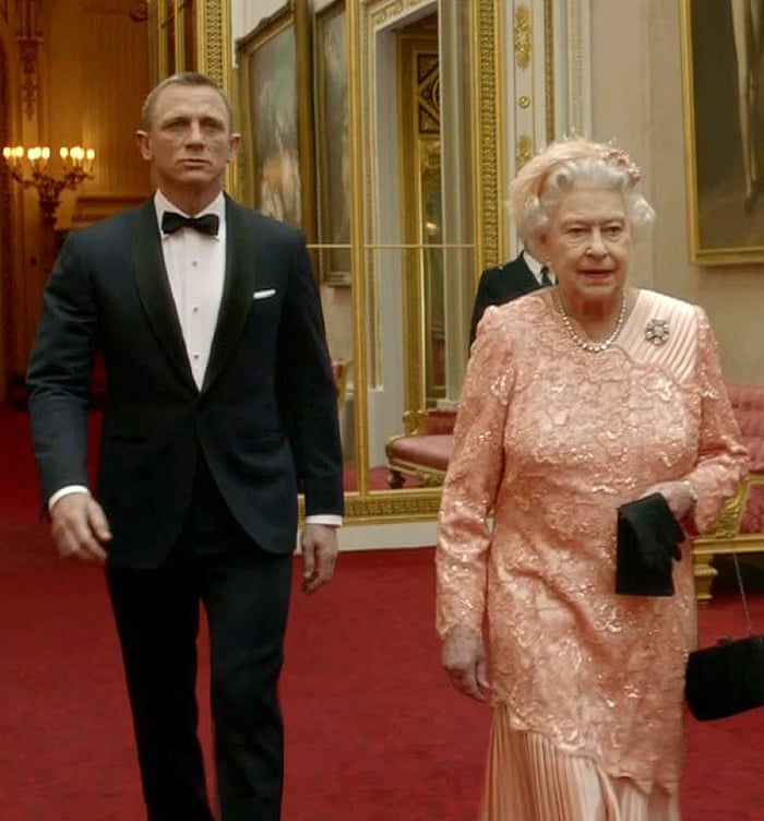 Daniel Craig as James Bond escorting the Queen through Buckingham Palace for the opening of the 2012 London Olympics.